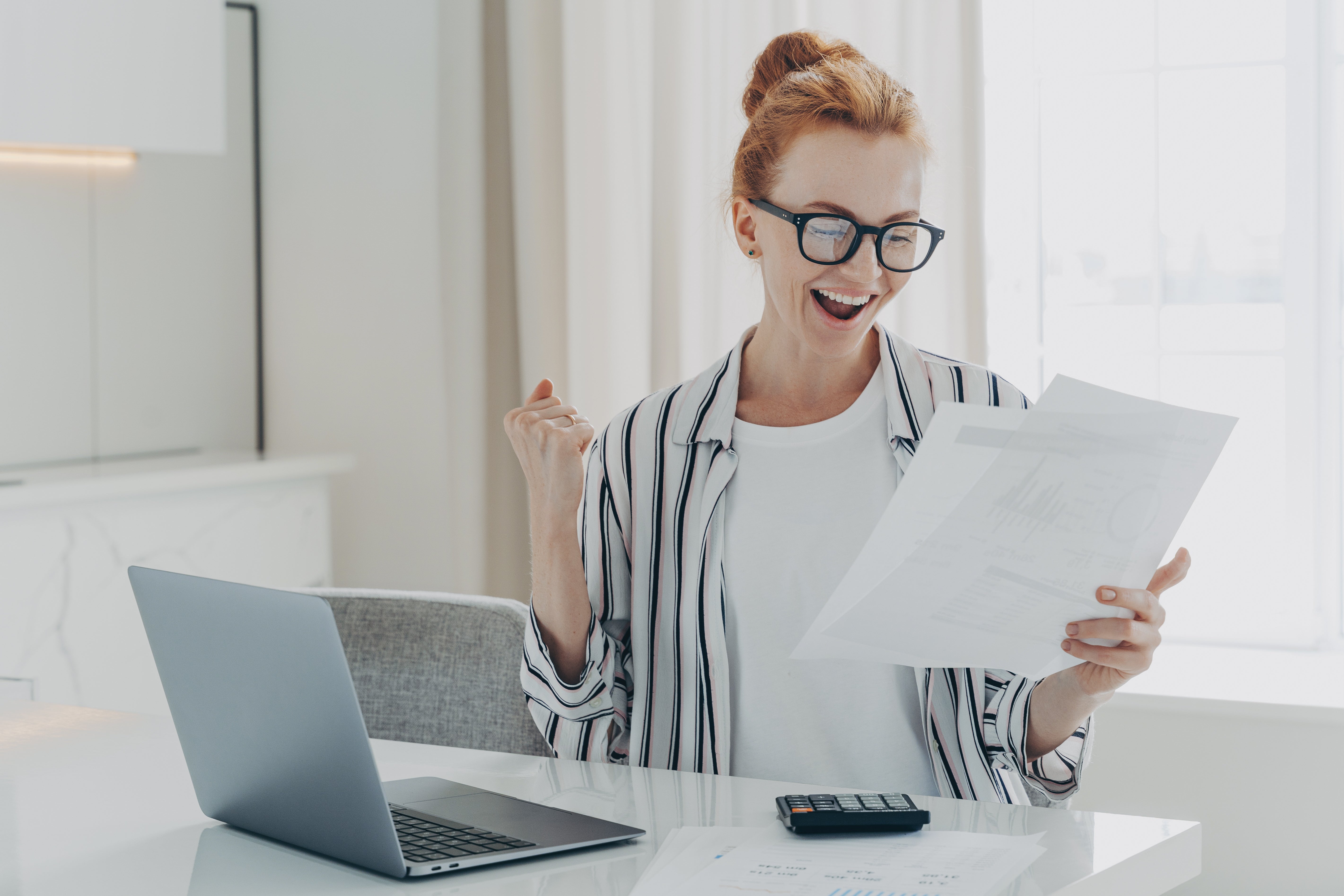 woman excited about low electric bill