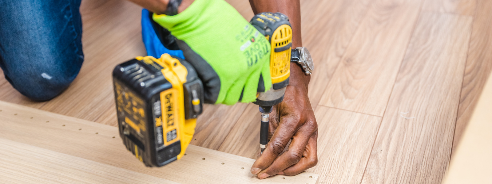 Person drilling a board