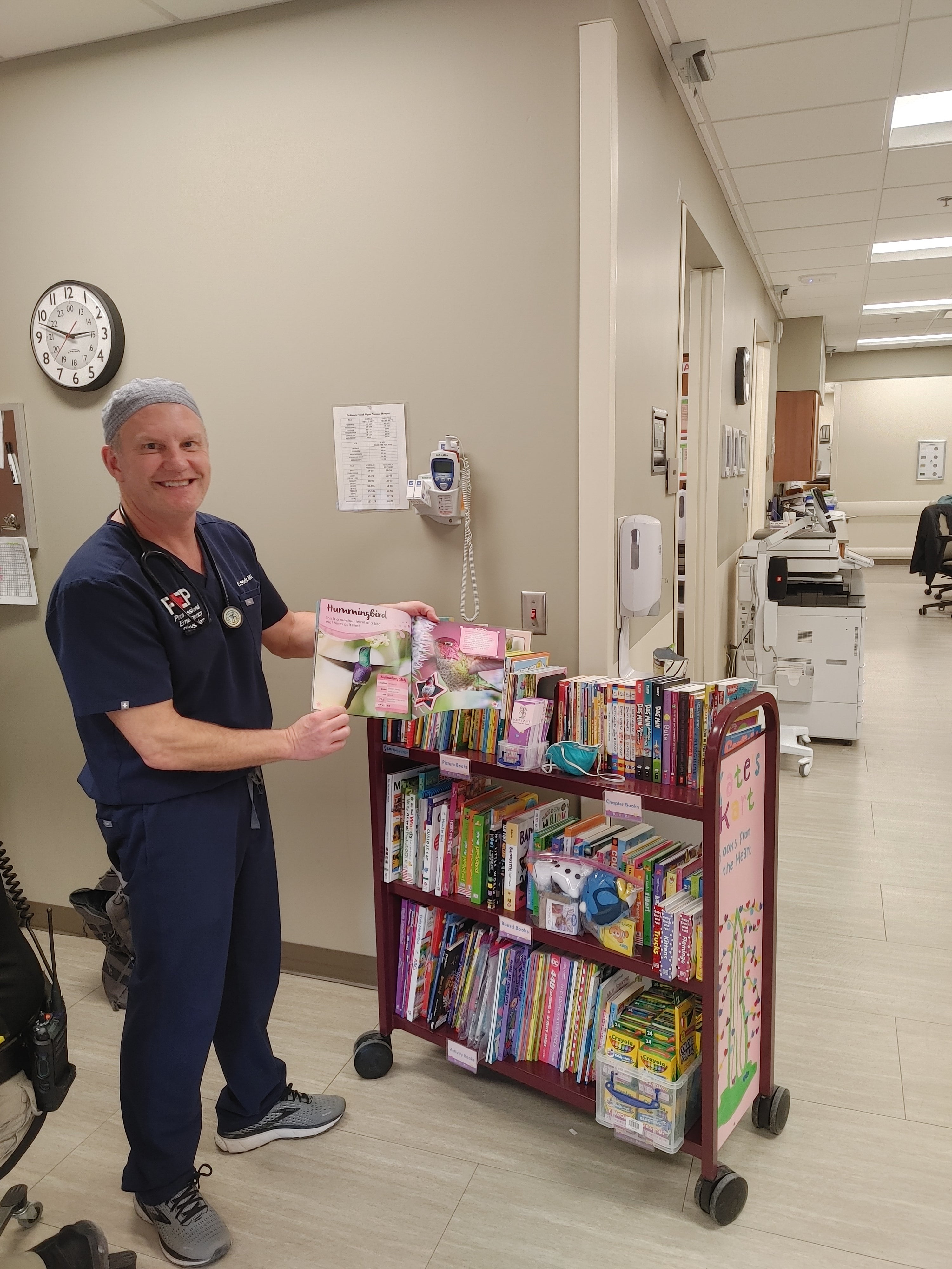 ER doctor with a Kate's Kart book cart