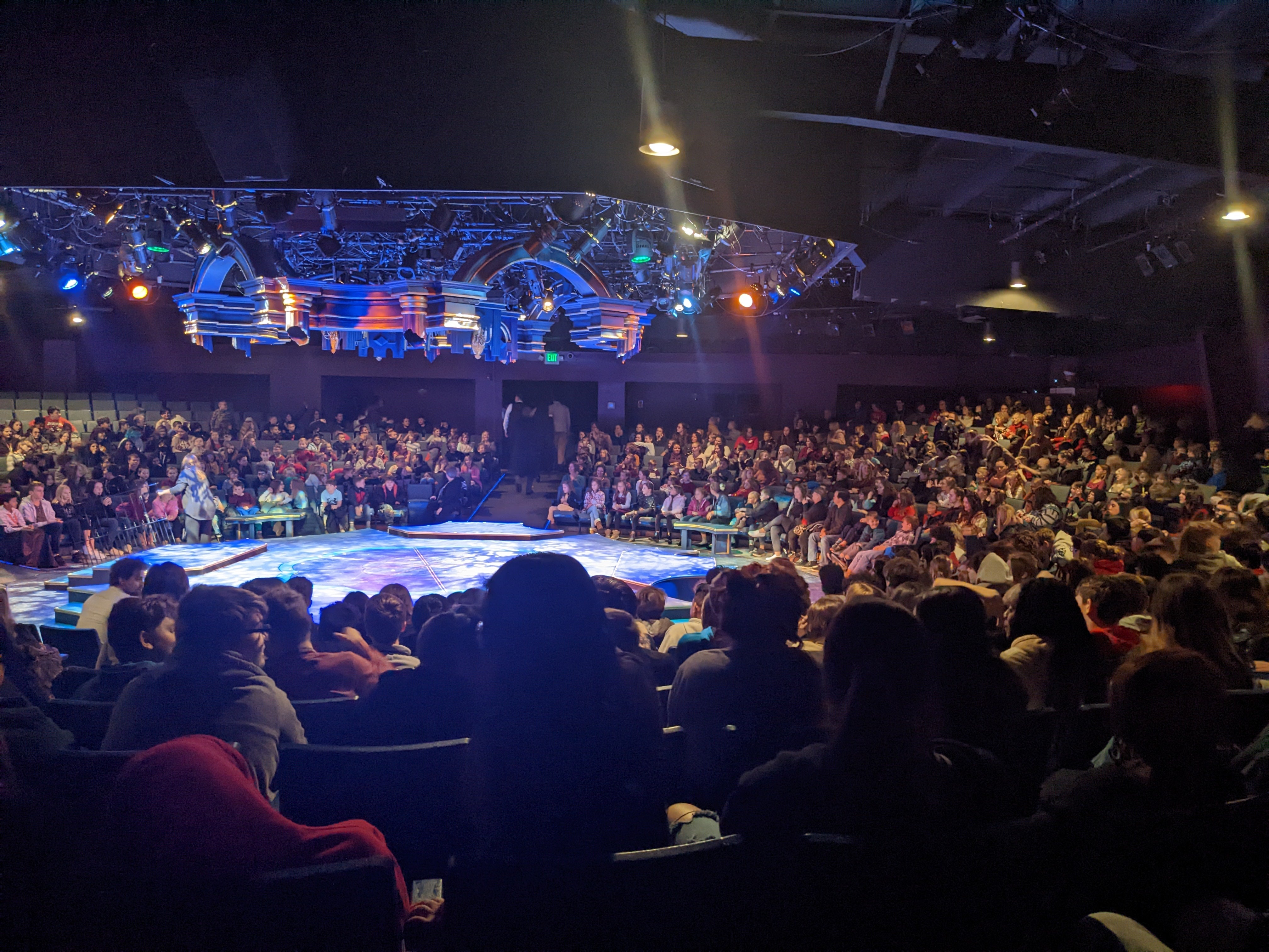 Students filling Wagon Wheel auditorium, waiting for show to start