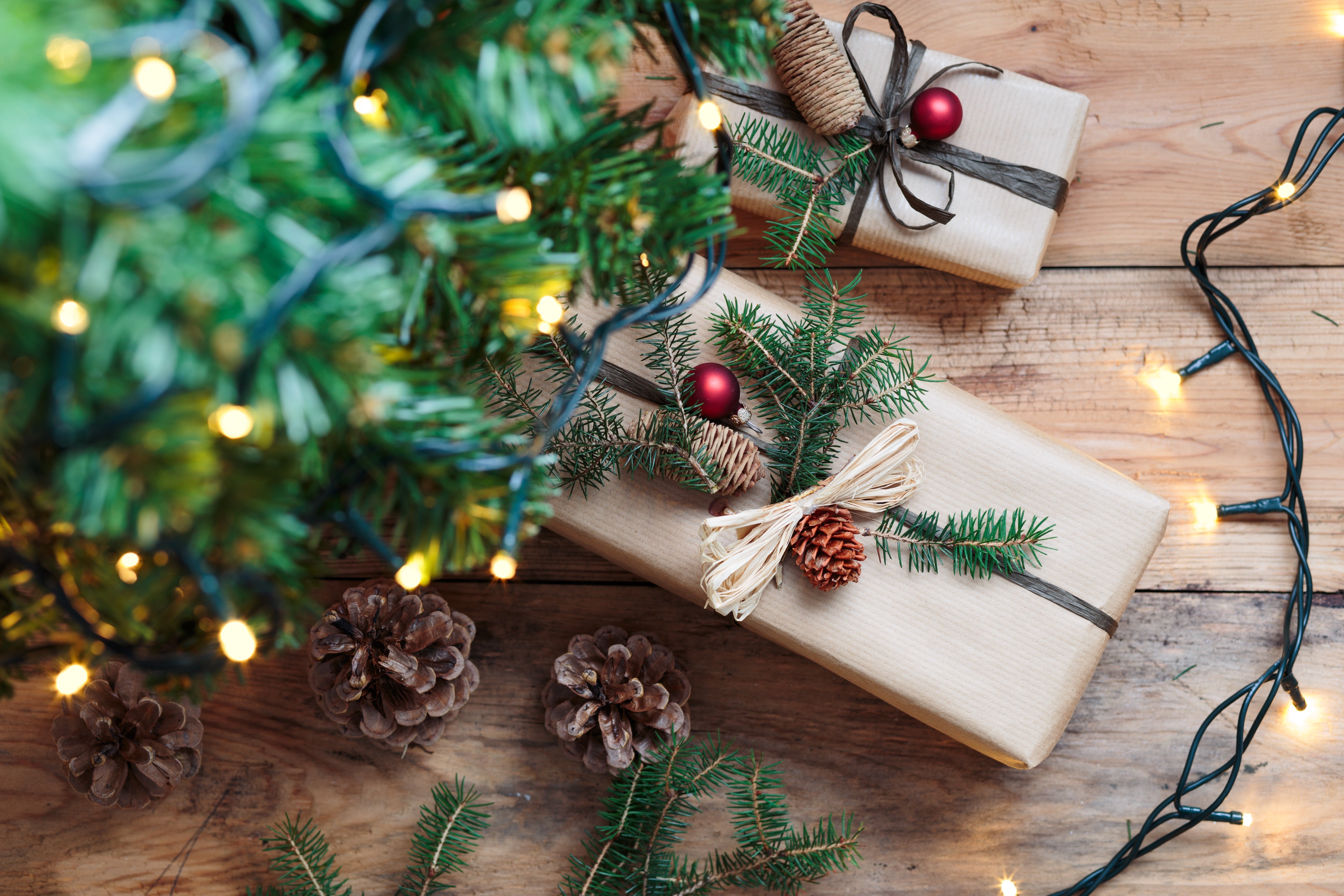 Christmas gifts under lit-up Christmas tree