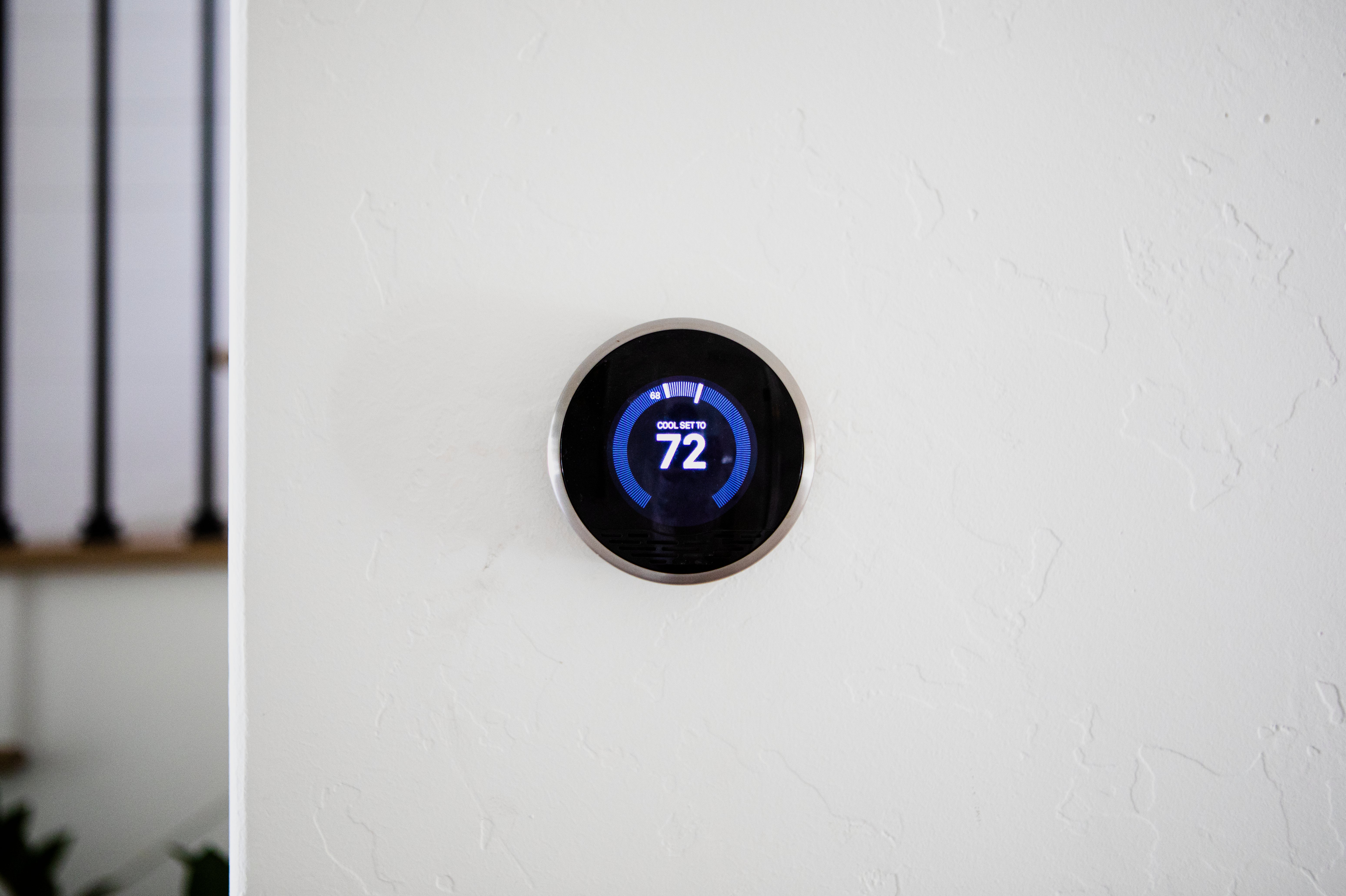 Modern smart thermostat on wall