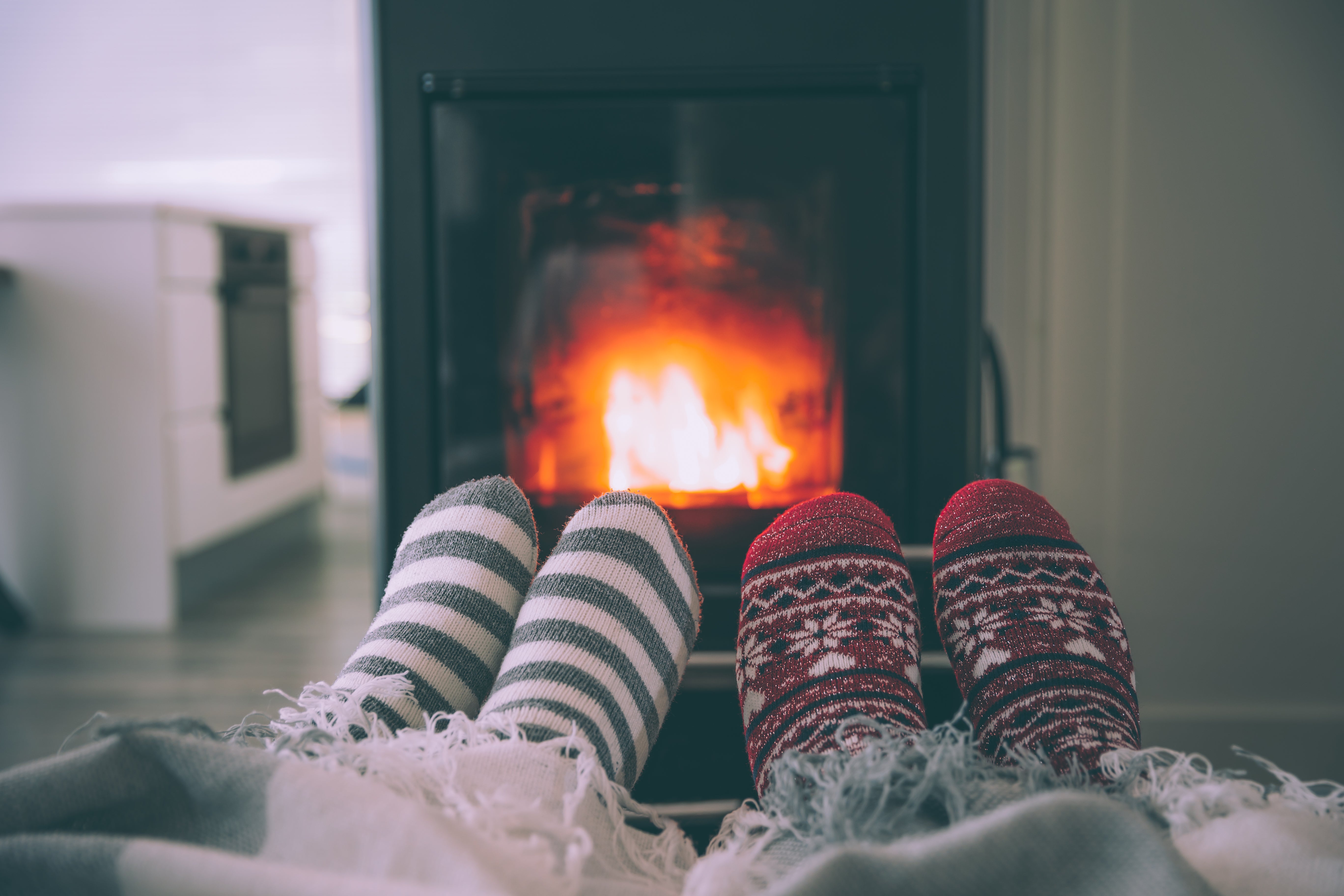 Cozy feet by fireplace