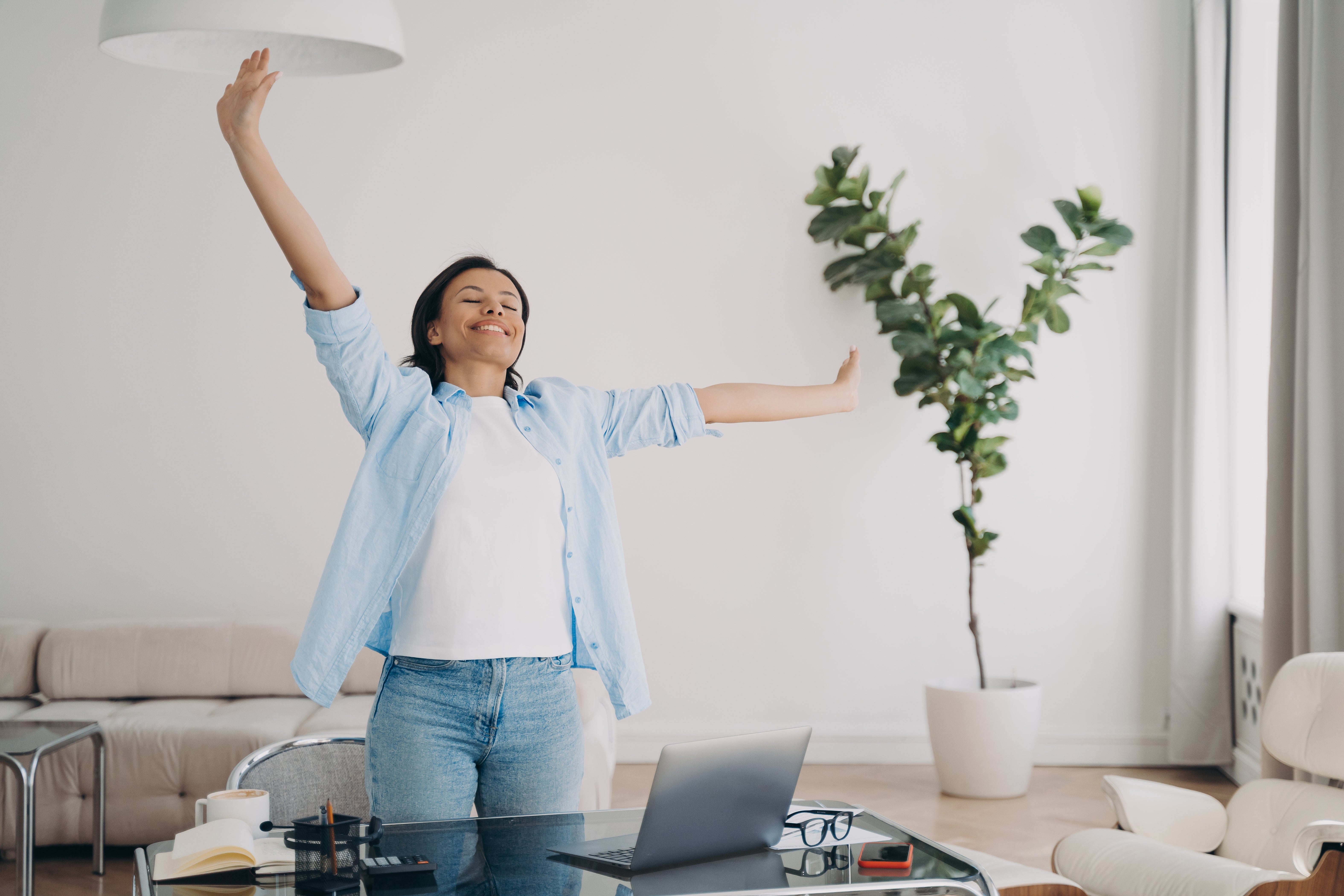 Woman rejoicing that the work day is over