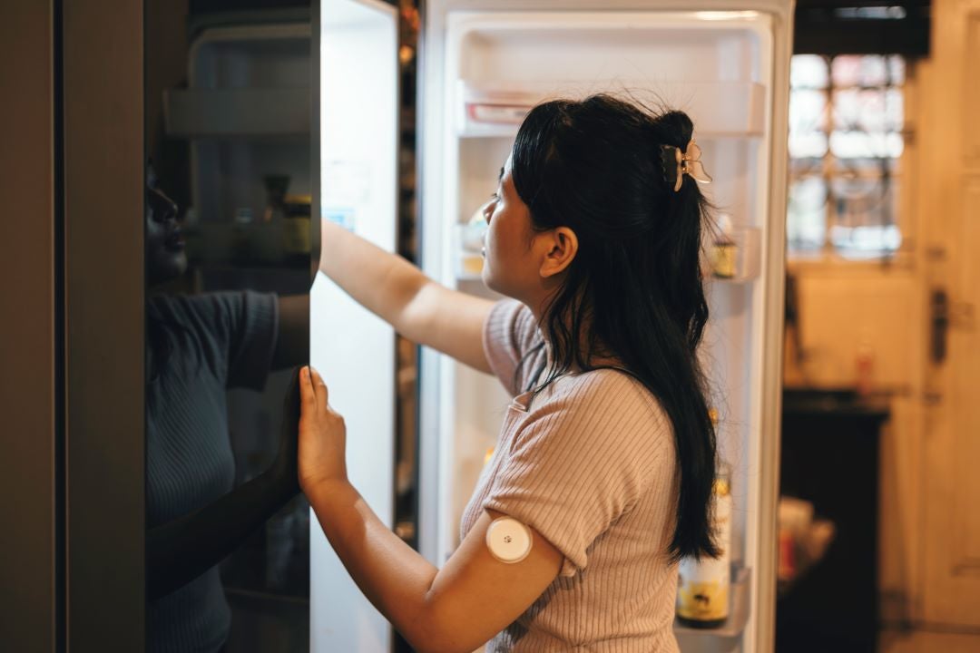 Woman at refrigerator