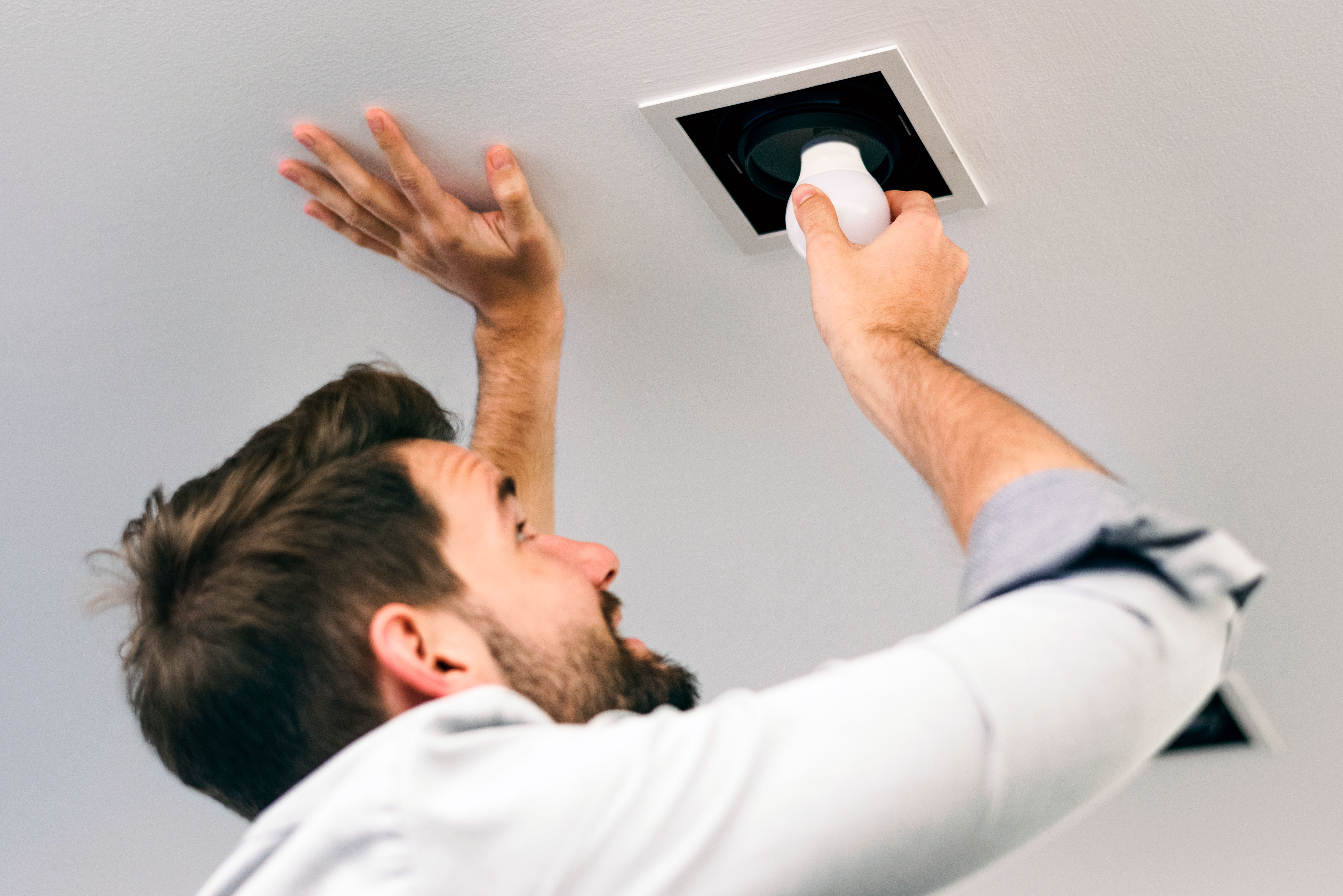 Man changing light bulb