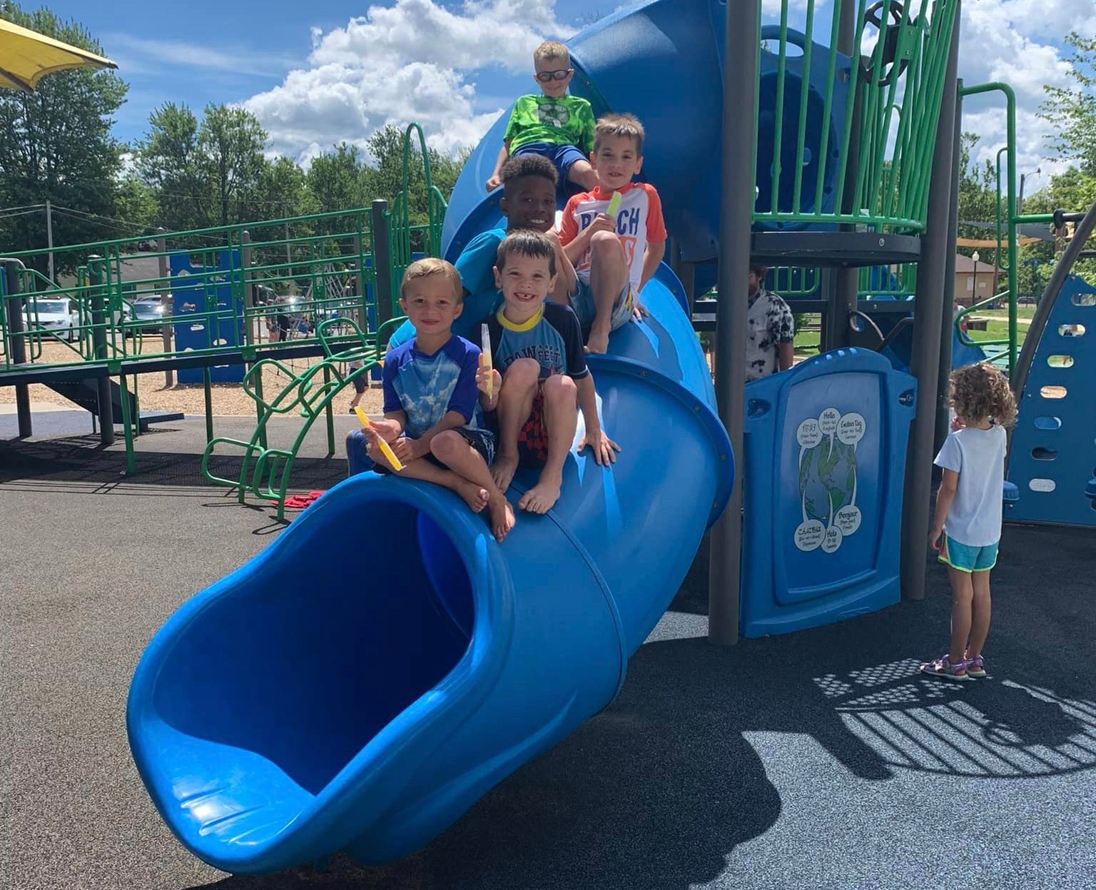 Kids on slide with popsicles at Winona Lake Park